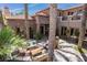 Tranquil outdoor patio with comfortable seating area, mature trees and a peaceful ambiance at 12097 Oakland Hills Dr, Las Vegas, NV 89141