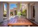 Covered patio with large wooden table and seating, perfect for outdoor dining and entertaining at 12097 Oakland Hills Dr, Las Vegas, NV 89141