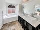Bright bathroom featuring double sinks and a soaking tub at 132 Montclair Dr, Henderson, NV 89074
