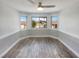 Charming dining room with hardwood flooring, wainscoting, and backyard views at 132 Montclair Dr, Henderson, NV 89074