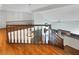 Open entryway featuring hardwood floors, staircase, and views of the living room with fireplace and built-in shelves at 132 Montclair Dr, Henderson, NV 89074