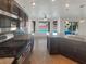 Gourmet kitchen featuring granite countertops, stainless steel appliances, and backyard pool views at 132 Montclair Dr, Henderson, NV 89074