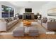 Bright living room featuring a cozy fireplace and stylish, neutral toned furniture at 132 Montclair Dr, Henderson, NV 89074