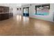 Open concept living space with tile flooring and view of backyard pool at 132 Montclair Dr, Henderson, NV 89074