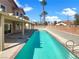 Backyard pool perfect for outdoor relaxation and entertainment, surrounded by lush greenery and sunny skies at 132 Montclair Dr, Henderson, NV 89074