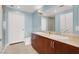 Well-lit bathroom with dual sinks, granite countertops, and tiled floors at 150 Las Vegas Blvd # 918, Las Vegas, NV 89101