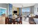 Inviting living area boasts modern decor, a dining table, and expansive windows with scenic views at 150 Las Vegas Blvd # 918, Las Vegas, NV 89101