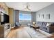 Comfortable living room with a plush sectional sofa, scenic views and hardwood floors at 150 Las Vegas Blvd # 918, Las Vegas, NV 89101