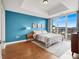 Serene bedroom featuring a calming color palette, hardwood floors, and a large window showcasing city views at 150 Las Vegas Blvd # 918, Las Vegas, NV 89101