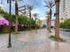 Palm tree lined outdoor mall with a decorative walkway and decorative lighting and landscaping at 150 Las Vegas Blvd # 918, Las Vegas, NV 89101