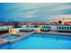 Stunning rooftop pool with city skyline views, surrounded by lounge areas and lush greenery at 150 Las Vegas Blvd # 918, Las Vegas, NV 89101