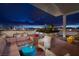 A luxurious rooftop terrace with comfortable seating, city views, and stylish design under the pergola at 150 Las Vegas Blvd # 918, Las Vegas, NV 89101