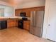 Kitchen featuring stainless steel refrigerator and black appliances at 1820 Peridot Point St, Las Vegas, NV 89106