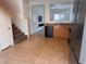 The kitchen features stainless steel refrigerator and opens to the living room and stairs at 1820 Peridot Point St, Las Vegas, NV 89106