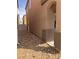 The home has a side yard with gravel landscaping, and a concrete walkway at 1820 Peridot Point St, Las Vegas, NV 89106