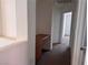 Upstairs hallway with a small desk, leading to the bedrooms at 1820 Peridot Point St, Las Vegas, NV 89106