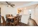 Cozy dining area featuring a wood table with chairs, flowing into an open kitchen, with hardwood style flooring at 1830 N Pecos Rd # 137, Las Vegas, NV 89115