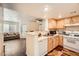 Functional kitchen with essential appliances and view into the living area, for easy conversation at 1830 N Pecos Rd # 137, Las Vegas, NV 89115