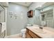 Bathroom featuring a glass-enclosed shower, neutral tile, and a modern vanity at 209 Crosswind Way, Las Vegas, NV 89145