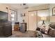 Cozy bonus room with a ceiling fan, sliding closet and a comfortable leather sofa at 209 Crosswind Way, Las Vegas, NV 89145