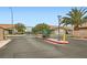 Gated community entrance with secure access and well-maintained landscaping for a welcoming first impression at 209 Crosswind Way, Las Vegas, NV 89145