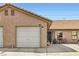 Charming home exterior with a one-car garage, a welcoming front entrance, and desert-style landscaping at 209 Crosswind Way, Las Vegas, NV 89145