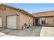 Attractive exterior view of a single-story home with a garage, welcoming front porch, and well-maintained landscaping at 209 Crosswind Way, Las Vegas, NV 89145