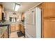 Efficient kitchen with oak cabinetry, granite countertops, and modern appliances for culinary enjoyment at 209 Crosswind Way, Las Vegas, NV 89145