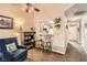 Cozy living room with an open layout, breakfast bar seating, and easy access to the kitchen and hallway at 209 Crosswind Way, Las Vegas, NV 89145