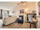Comfortable and open living room with cozy seating, a ceiling fan, and a convenient breakfast bar area at 209 Crosswind Way, Las Vegas, NV 89145