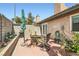 Inviting patio space with stone fire pit, seating, and lush plants creating a private outdoor retreat at 209 Crosswind Way, Las Vegas, NV 89145