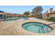 Community pool and spa surrounded by lush landscaping and a secure fence, creating a relaxing oasis at 209 Crosswind Way, Las Vegas, NV 89145