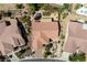 An aerial view showcases this desert home's terra cotta roof, neat landscaping, and nearby walking paths at 2606 Crested Butte St, Henderson, NV 89052