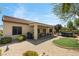 Charming backyard featuring covered patio, artificial grass, hot tub, and desert landscaping at 2606 Crested Butte St, Henderson, NV 89052