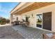 Cozy covered patio features a dining area and grill, perfect for outdoor entertaining at 2606 Crested Butte St, Henderson, NV 89052