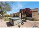 Landscaped backyard features a hot tub and mature trees, creating a tranquil and private retreat at 2606 Crested Butte St, Henderson, NV 89052