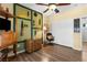 Clean bedroom featuring creative decor, closet, a ceiling fan, and wood floors at 2606 Crested Butte St, Henderson, NV 89052