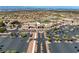 Aerial view of a large community center, parking, and the manicured landscaping showcases the neighborhood's amenities at 2606 Crested Butte St, Henderson, NV 89052