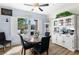 Cozy dining area features a round table, a hutch, and a window with natural light at 2606 Crested Butte St, Henderson, NV 89052