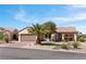 Inviting single-story home with a two-car garage, landscaped front yard, and charming curb appeal at 2606 Crested Butte St, Henderson, NV 89052