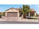Lovely single-story home with a two-car garage, desert landscaping and comfortable front porch at 2606 Crested Butte St, Henderson, NV 89052