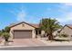 Attractive single-story home with a two-car garage, desert landscaping and a tiled roof at 2606 Crested Butte St, Henderson, NV 89052