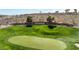 Sun City Anthem golf course with vibrant green grass and a well-maintained putting green at 2606 Crested Butte St, Henderson, NV 89052