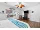 Spacious main bedroom featuring a large window, hardwood floors, and natural light at 2606 Crested Butte St, Henderson, NV 89052