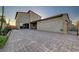 Expansive backyard featuring brick pavers, a covered patio, and a secure gate, creating a private outdoor oasis at 2669 Via Monet, Henderson, NV 89044