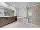 Bathroom features double sinks, a soaking tub, and a glass enclosed shower with tile surround at 2669 Via Monet, Henderson, NV 89044