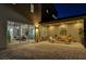 Stunning covered patio offering outdoor seating, a charming arched mirror, and seamless access to the living area at 2669 Via Monet, Henderson, NV 89044