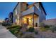 Modern two-story home with a balcony, covered porch and desert landscaping in a quiet neighborhood at 2669 Via Monet, Henderson, NV 89044