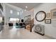 Bright, open-concept living area with high ceilings, modern decor, and seamless indoor-outdoor flow at 2669 Via Monet, Henderson, NV 89044