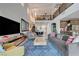 Spacious, open-concept living area with high ceilings, a loft, and seamless flow to the kitchen at 2669 Via Monet, Henderson, NV 89044